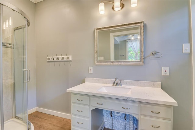 844 Heard Ave, Augusta, GA 30904 - full bathroom featuring vanity, a stall shower, and wood finished floors