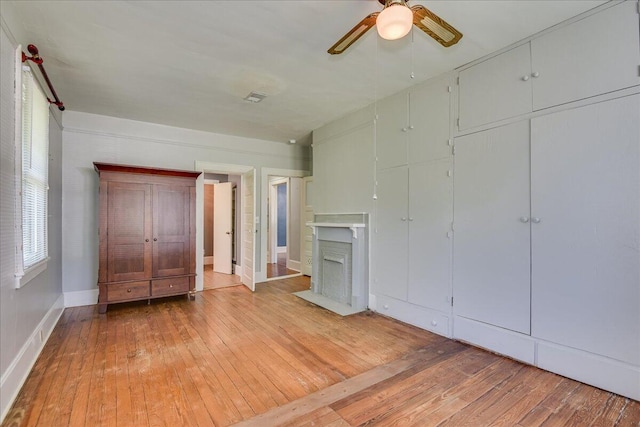 844 Heard Ave, Augusta, GA 30904 - unfurnished living room with hardwood / wood-style flooring, a fireplace with flush hearth, and a ceiling fan