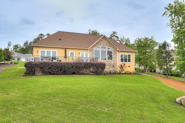 139 Laurens Dr, Mccormick, SC 29835 - rear view of property featuring stone siding, a lawn, and a shingled roof