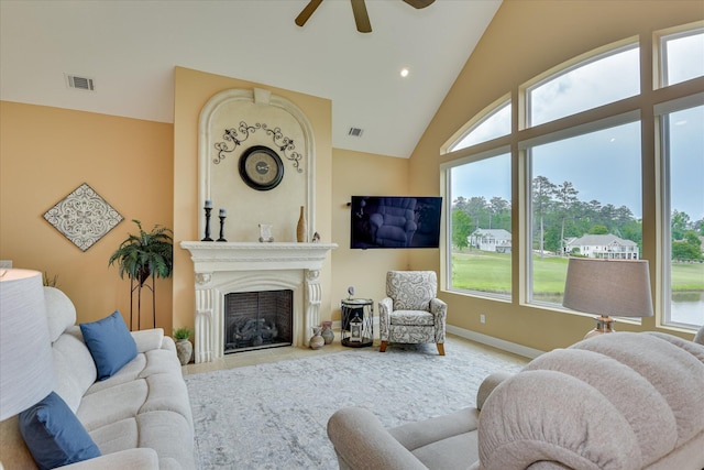 139 Laurens Dr, Mccormick, SC 29835 - living room with ceiling fan, plenty of natural light, a fireplace, baseboards, and high vaulted ceiling