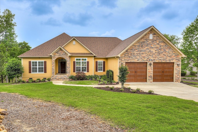 139 Laurens Dr, Mccormick, SC 29835 - view of front of home with driveway, stone siding, an attached garage, a front lawn, and a shingled roof