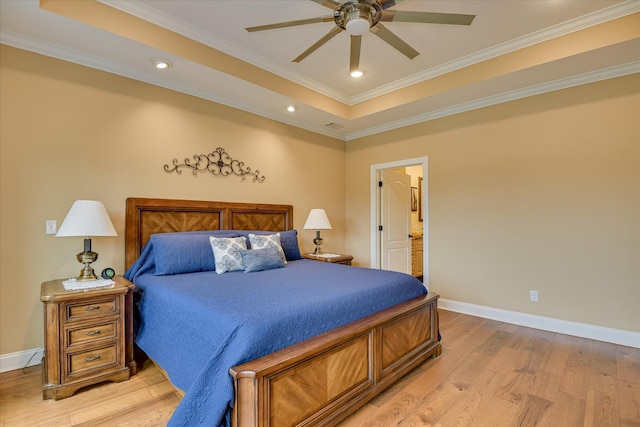 139 Laurens Dr, Mccormick, SC 29835 - bedroom with light wood-style flooring, baseboards, crown molding, a raised ceiling, and ensuite bath