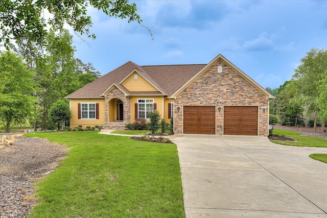 139 Laurens Dr, Mccormick, SC 29835 - view of front facade with concrete driveway, a front lawn, a garage, and stone siding