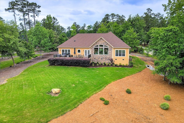 139 Laurens Dr, Mccormick, SC 29835 - view of front facade featuring stone siding, a front lawn, and a patio