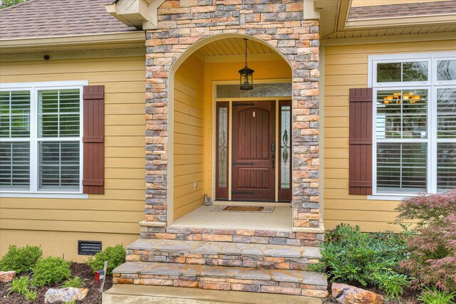 139 Laurens Dr, Mccormick, SC 29835 - entrance to property with roof with shingles, crawl space, and stone siding