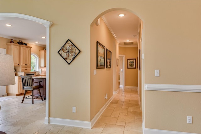 139 Laurens Dr, Mccormick, SC 29835 - corridor with stone tile flooring, ornamental molding, arched walkways, recessed lighting, and baseboards