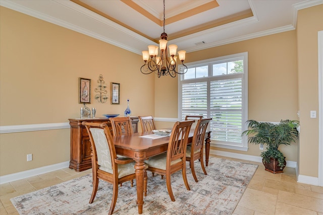 139 Laurens Dr, Mccormick, SC 29835 - dining room with a chandelier, a raised ceiling, ornamental molding, baseboards, and stone tile flooring