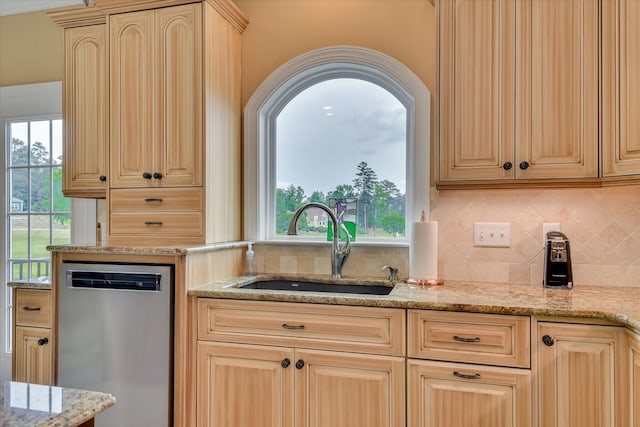 139 Laurens Dr, Mccormick, SC 29835 - kitchen featuring stainless steel dishwasher, a sink, light brown cabinetry, and backsplash