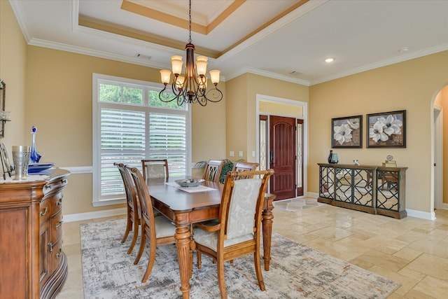 139 Laurens Dr, Mccormick, SC 29835 - dining area with a chandelier, arched walkways, stone tile floors, ornamental molding, and baseboards