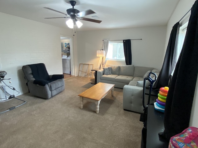 3406 Pine Hill Rd, Hephzibah, GA 30815 - carpeted living room with a ceiling fan and washer and clothes dryer