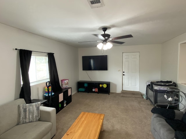 3406 Pine Hill Rd, Hephzibah, GA 30815 - living room with carpet flooring, a ceiling fan, and visible vents
