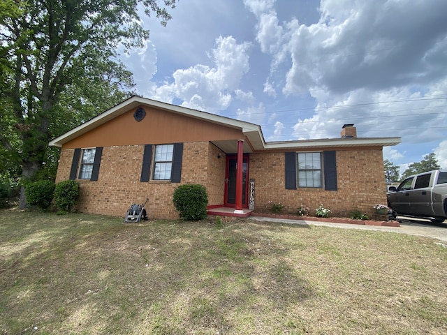 3406 Pine Hill Rd, Hephzibah, GA 30815 - ranch-style home with a chimney, a front lawn, and brick siding