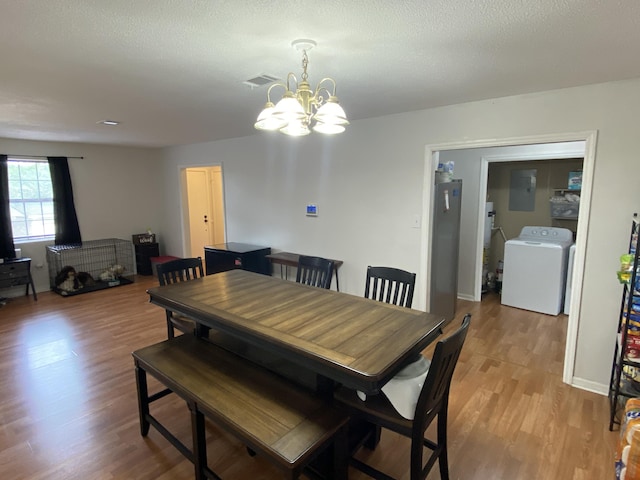 3406 Pine Hill Rd, Hephzibah, GA 30815 - dining room with washer / dryer, visible vents, and light wood-style floors