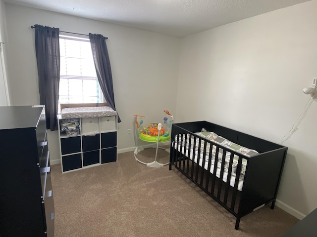 3406 Pine Hill Rd, Hephzibah, GA 30815 - bedroom featuring carpet floors, baseboards, and a crib