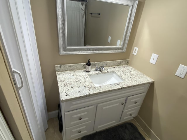 3406 Pine Hill Rd, Hephzibah, GA 30815 - bathroom featuring baseboards, tile patterned flooring, and vanity