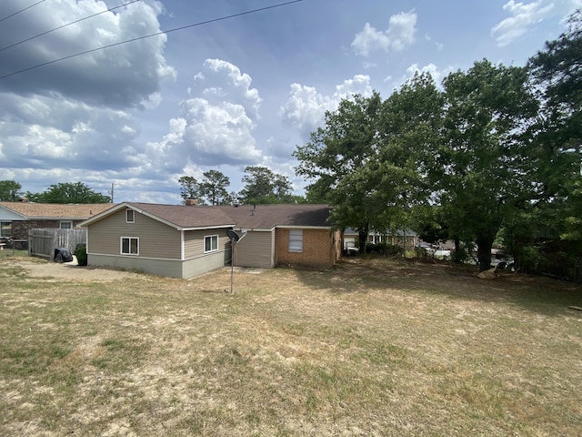 3406 Pine Hill Rd, Hephzibah, GA 30815 - back of property featuring a lawn and fence