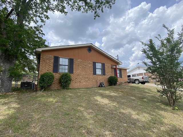 3406 Pine Hill Rd, Hephzibah, GA 30815 - view of side of property with fence, a yard, and brick siding