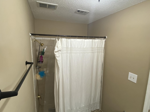 3406 Pine Hill Rd, Hephzibah, GA 30815 - full bathroom featuring visible vents, a textured ceiling, and curtained shower