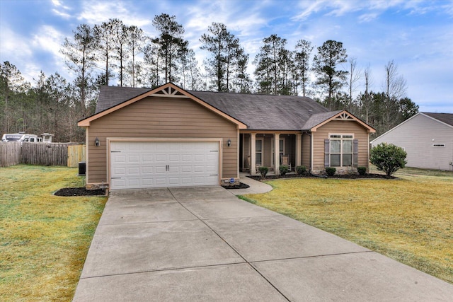 single story home featuring a garage and a front lawn