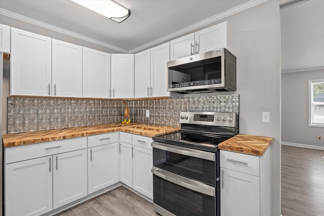 3589 Jonathan Cir, Augusta, GA 30906 - kitchen with wood counters, stainless steel appliances, crown molding, light wood finished floors, and decorative backsplash
