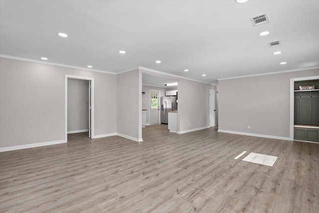 3589 Jonathan Cir, Augusta, GA 30906 - unfurnished living room with recessed lighting, light wood-style floors, and crown molding