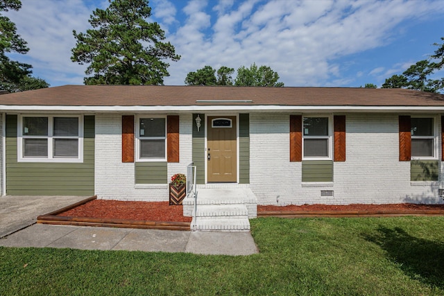 3589 Jonathan Cir, Augusta, GA 30906 - view of front facade with brick siding, a front lawn, and crawl space