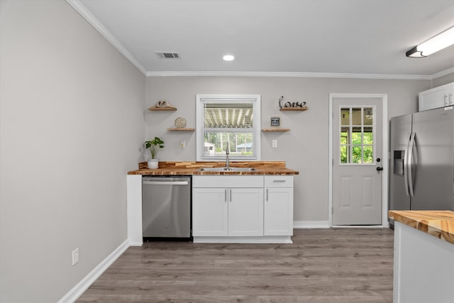 3589 Jonathan Cir, Augusta, GA 30906 - kitchen featuring wooden counters, appliances with stainless steel finishes, white cabinets, open shelves, and light wood-style floors