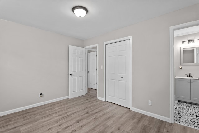 3589 Jonathan Cir, Augusta, GA 30906 - unfurnished bedroom with light wood-type flooring, a closet, and connected bathroom