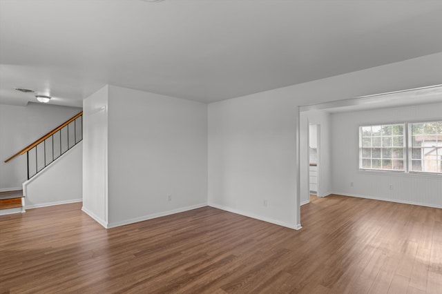 4004 Columbia Rd, Martinez, GA 30907 - empty room featuring wood finished floors, stairs, and baseboards
