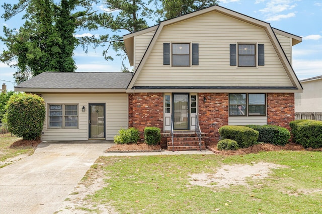 4004 Columbia Rd, Martinez, GA 30907 - dutch colonial featuring brick siding, a gambrel roof, and a front lawn