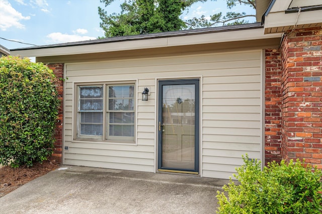 4004 Columbia Rd, Martinez, GA 30907 - view of exterior entry featuring brick siding and a patio area