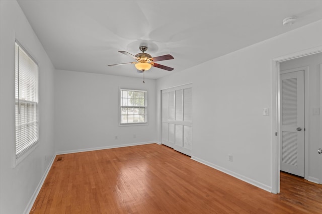 4004 Columbia Rd, Martinez, GA 30907 - unfurnished bedroom with wood finished floors, a closet, baseboards, and a ceiling fan