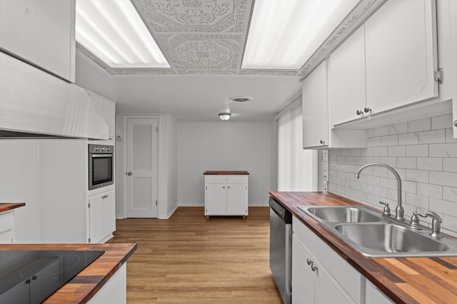 4004 Columbia Rd, Martinez, GA 30907 - kitchen with wooden counters, appliances with stainless steel finishes, a sink, and white cabinetry