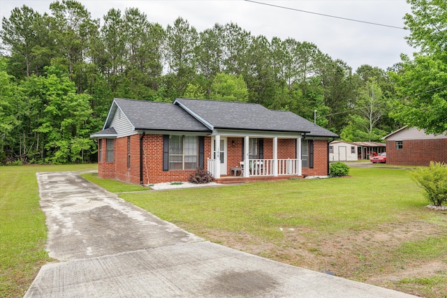 106 Allie Rd, Wrens, GA 30477 - ranch-style home featuring covered porch, brick siding, concrete driveway, and a front lawn