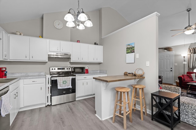 106 Allie Rd, Wrens, GA 30477 - kitchen featuring appliances with stainless steel finishes, under cabinet range hood, light wood-type flooring, high vaulted ceiling, and wood counters