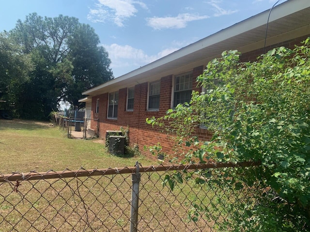 view of property exterior with a yard