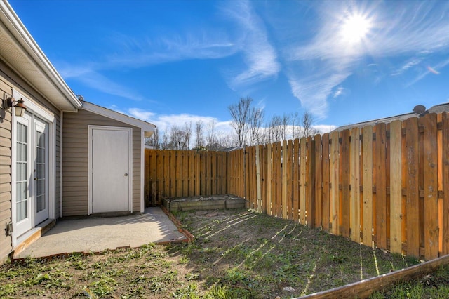 view of yard featuring a patio area and a fenced backyard