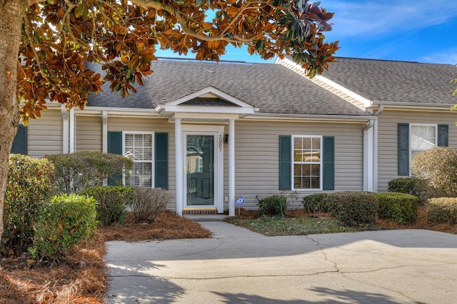 view of front of property with a shingled roof