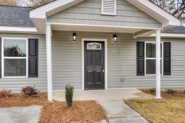 doorway to property with a porch