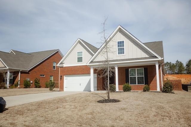 view of front of home featuring an attached garage, concrete driveway, board and batten siding, and brick siding