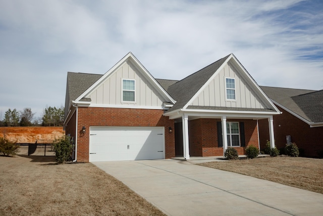 view of front facade featuring brick siding, a porch, concrete driveway, an attached garage, and board and batten siding