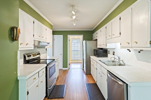 3701 Winchester Way, Martinez, GA 30907 - kitchen with under cabinet range hood, white cabinetry, a sink, and appliances with stainless steel finishes
