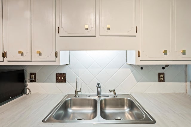 3701 Winchester Way, Martinez, GA 30907 - kitchen featuring white cabinets, light countertops, tasteful backsplash, and a sink