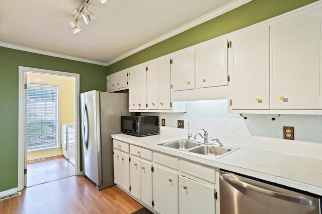 3701 Winchester Way, Martinez, GA 30907 - kitchen with a sink, crown molding, stainless steel appliances, white cabinets, and light wood-type flooring