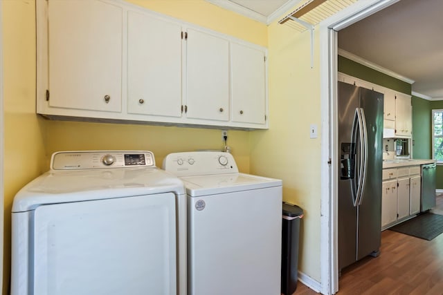 3701 Winchester Way, Martinez, GA 30907 - clothes washing area featuring cabinet space, washer and clothes dryer, wood finished floors, and ornamental molding