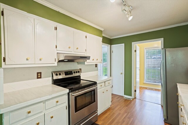 3701 Winchester Way, Martinez, GA 30907 - kitchen featuring white cabinetry, plenty of natural light, appliances with stainless steel finishes, and under cabinet range hood