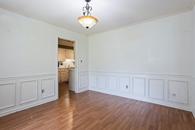 3701 Winchester Way, Martinez, GA 30907 - unfurnished room featuring wainscoting, a sink, a decorative wall, crown molding, and wood finished floors