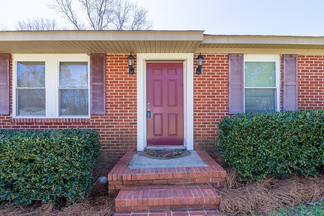 entrance to property with brick siding