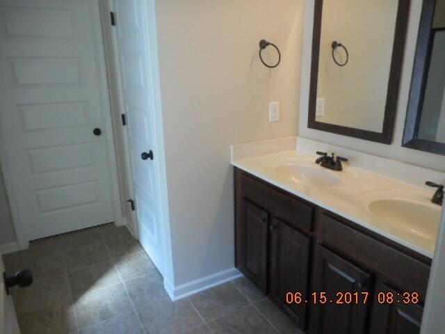 bathroom featuring vanity and tile patterned flooring