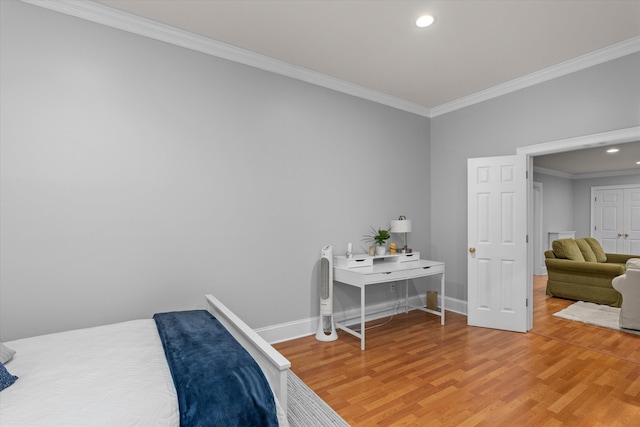 bedroom featuring crown molding and wood-type flooring